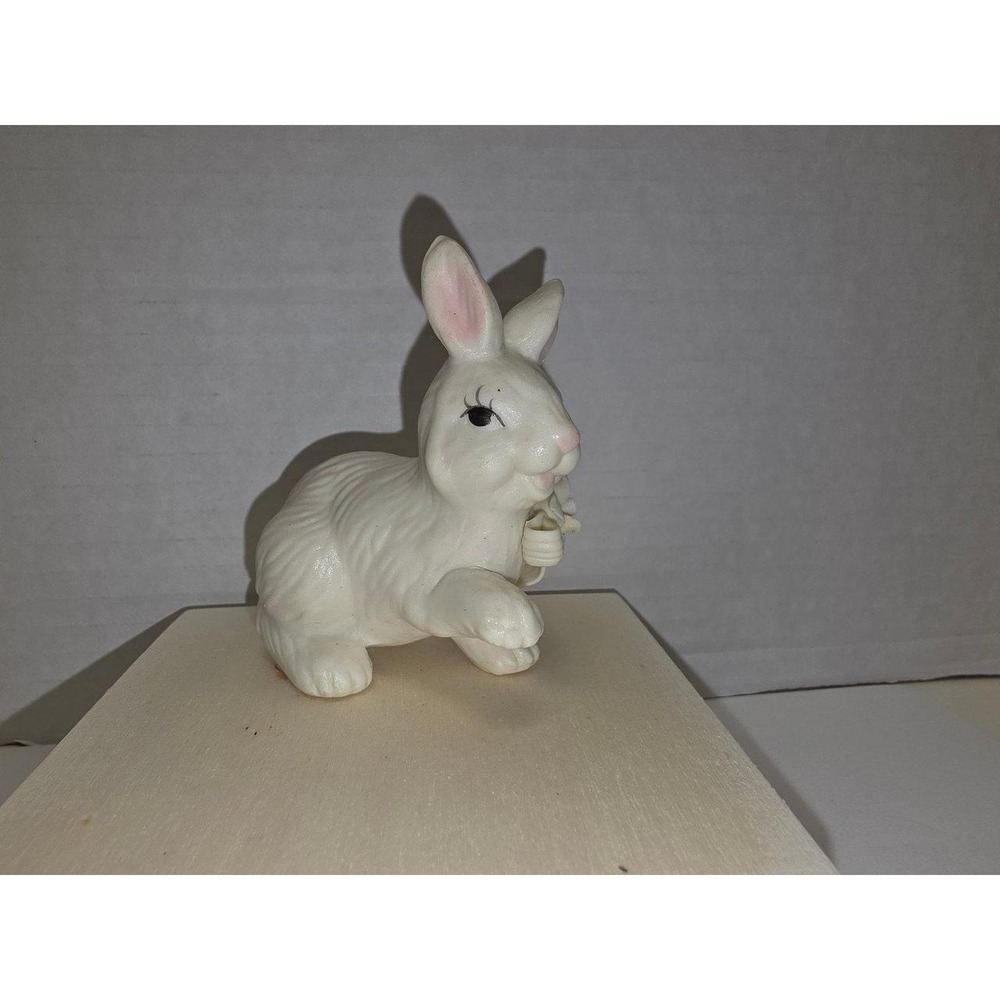 vintage white ceramic bunny figurine featuring hand-painted pink inner ears bow